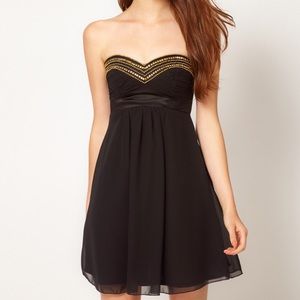 Black strapless dress with gold beaded bust